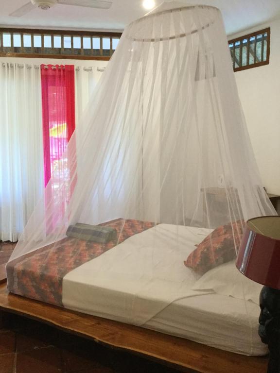 Postel nebo postele na pokoji v ubytování Villa Jati Mangsit