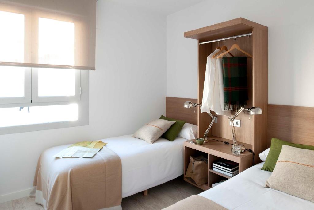 Postel nebo postele na pokoji v ubytování Eric Vökel Boutique Apartments - Atocha Suites