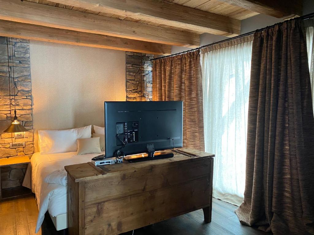 TV a/nebo společenská místnost v ubytování Les Neiges D'Antan