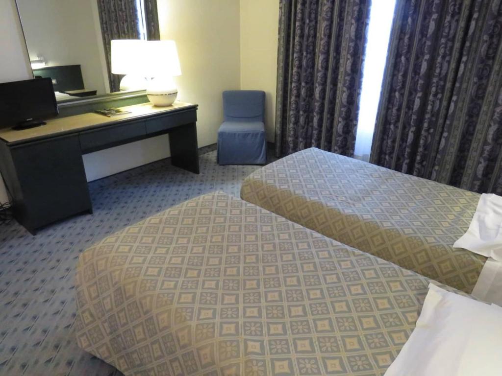 Postel nebo postele na pokoji v ubytování Hotel Turandot