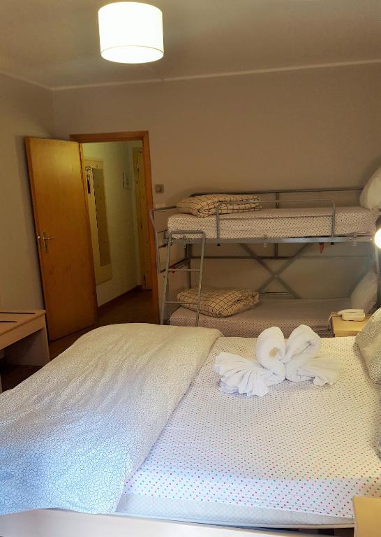 Postel nebo postele na pokoji v ubytování Hotel Principe Marmolada