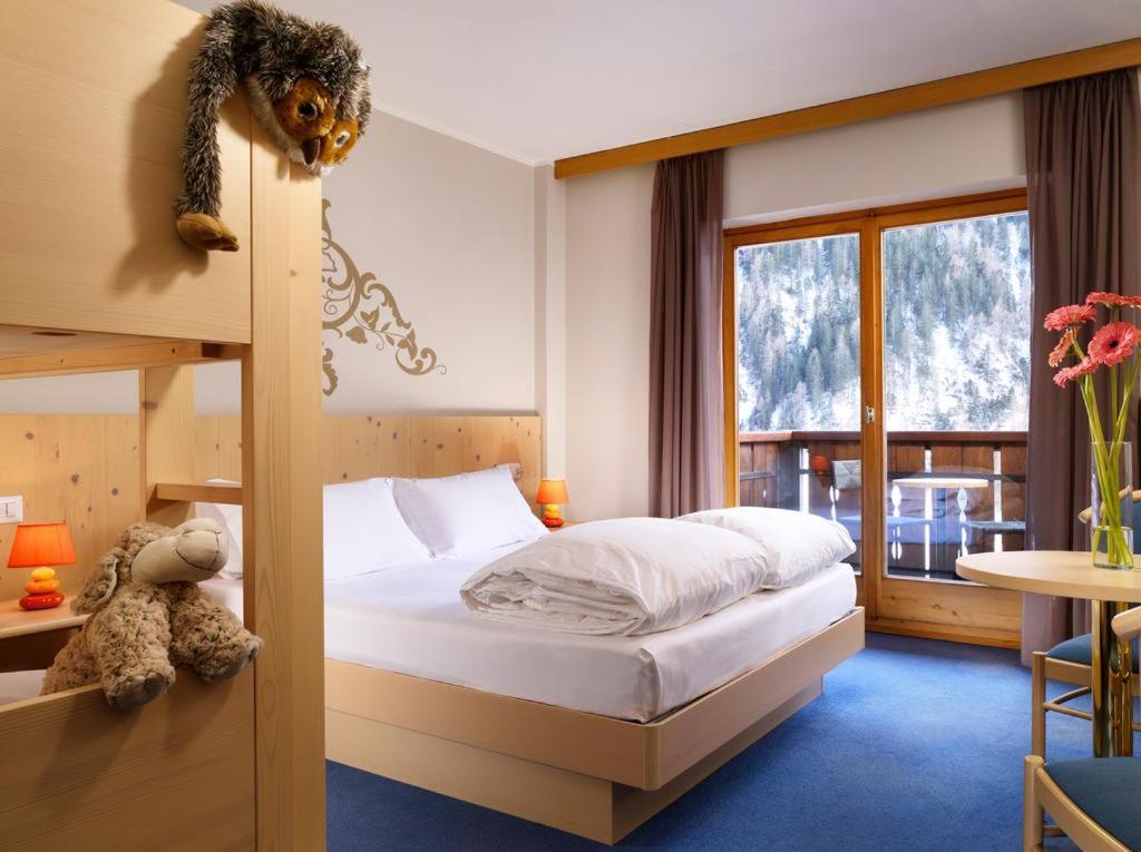 Postel nebo postele na pokoji v ubytování Hotel Principe Marmolada