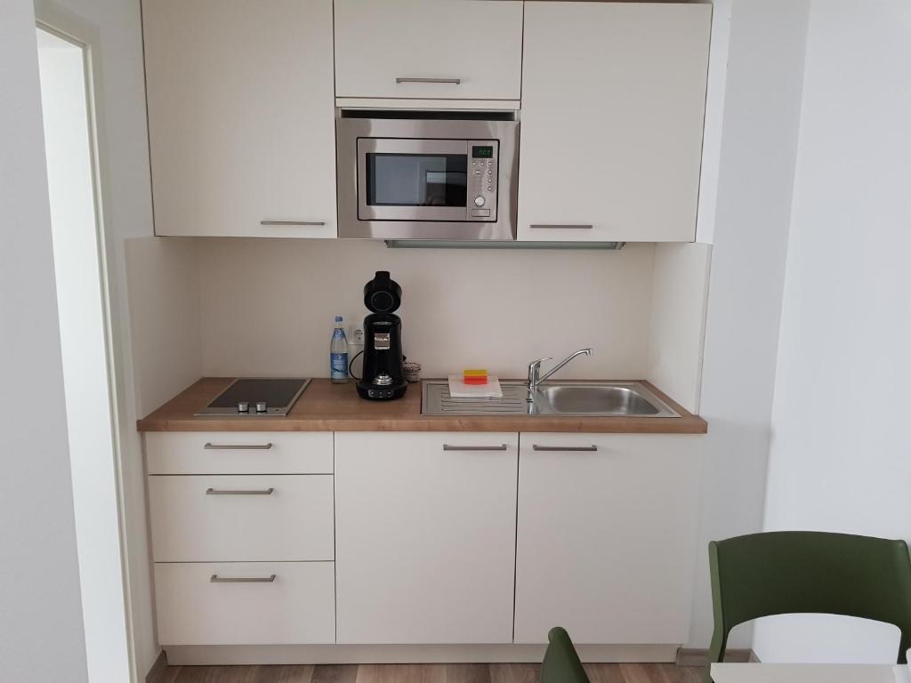 Kuchyň nebo kuchyňský kout v ubytování Boardinghouse Jungwirth-Wohnzeit