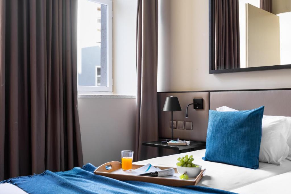 Postel nebo postele na pokoji v ubytování JOIVY Downtown Market Apartments