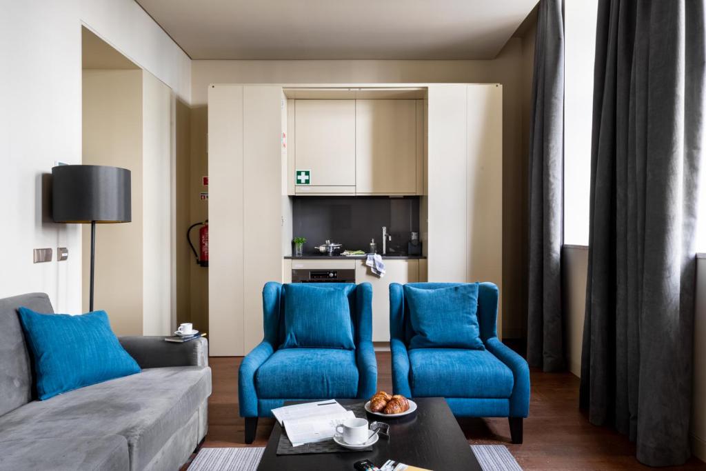 TV a/nebo společenská místnost v ubytování JOIVY Downtown Market Apartments