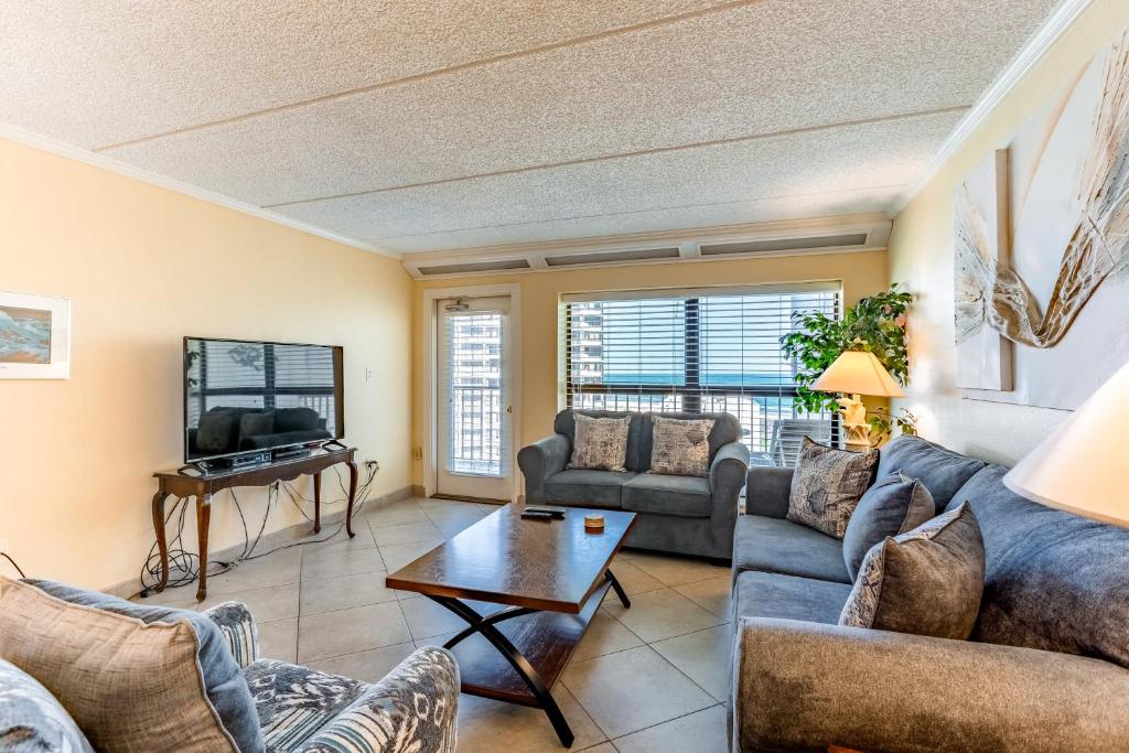 a living room with a couch and a table at Saida Towers IV #4906 in South Padre Island