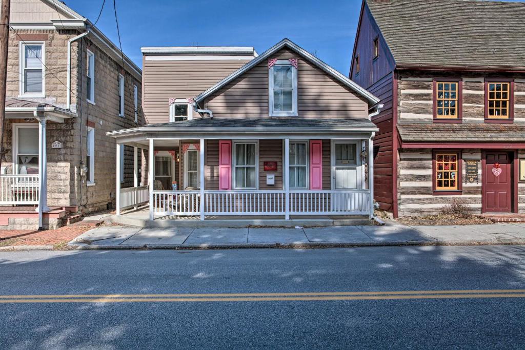 a house with pink doors on a street at Central Hummelstown Apt 4 Miles to Hershey Park! in Hummelstown