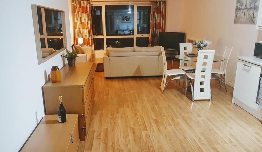 a living room with a couch and a table at Marco Island -Very Spacious City Centre 1 Bedroom Apartment in Nottingham