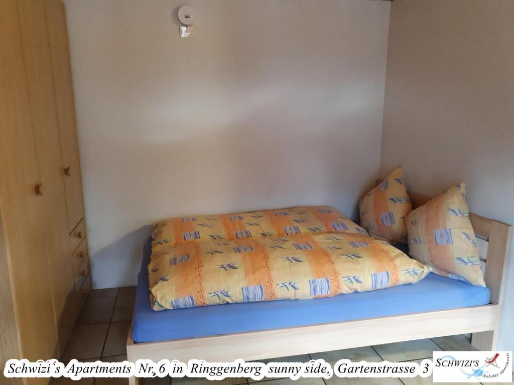 Postel nebo postele na pokoji v ubytování Schwizi's Apartments
