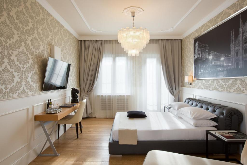 TV a/nebo společenská místnost v ubytování Suite Milano Duomo