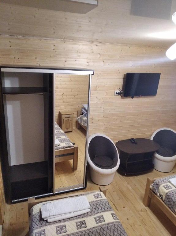 Postel nebo postele na pokoji v ubytování Lisnyi