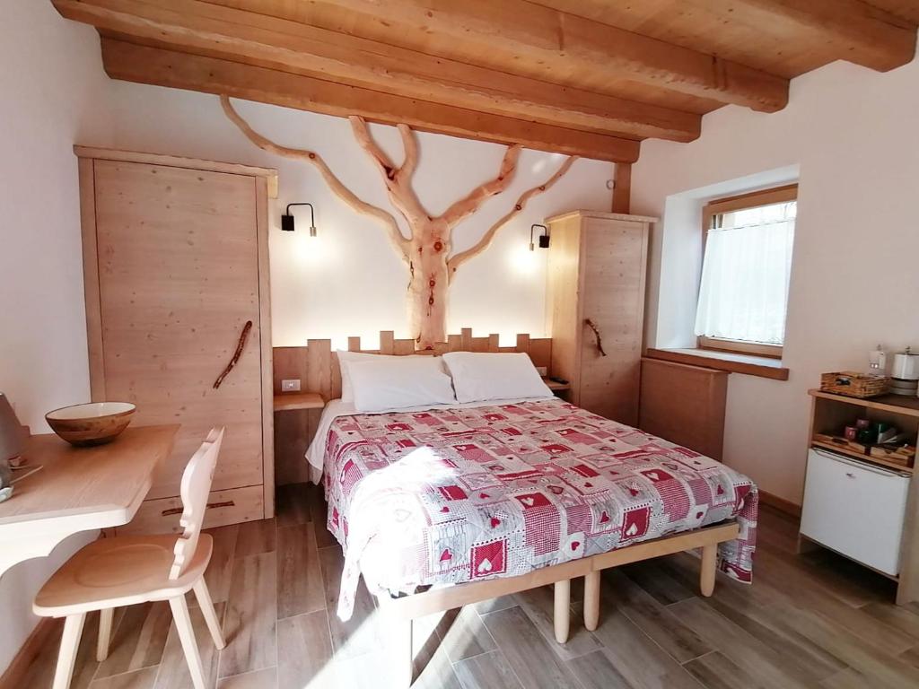 Postel nebo postele na pokoji v ubytování Ai Larici