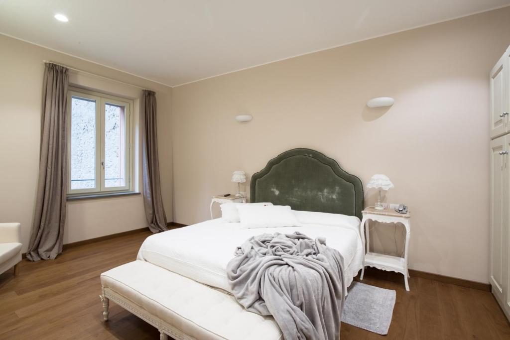 Säng eller sängar i ett rum på Agave in Città