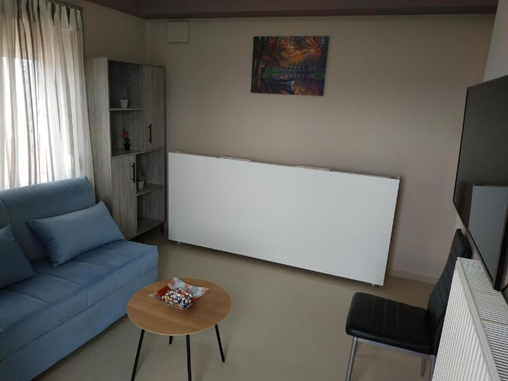 Televízia a/alebo spoločenská miestnosť v ubytovaní Psychiko's View
