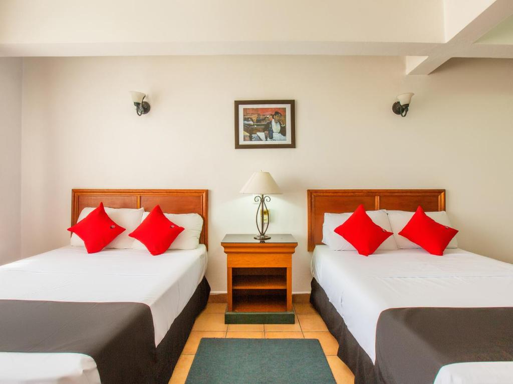 Hotel Santa Lucia tesisinde bir odada yatak veya yataklar