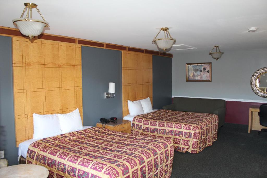 Postel nebo postele na pokoji v ubytování Liberty Inn Absecon Atlantic City