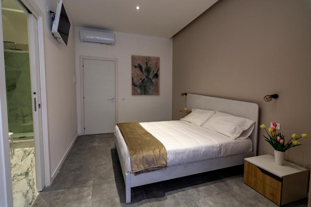 Postel nebo postele na pokoji v ubytování Dadà House