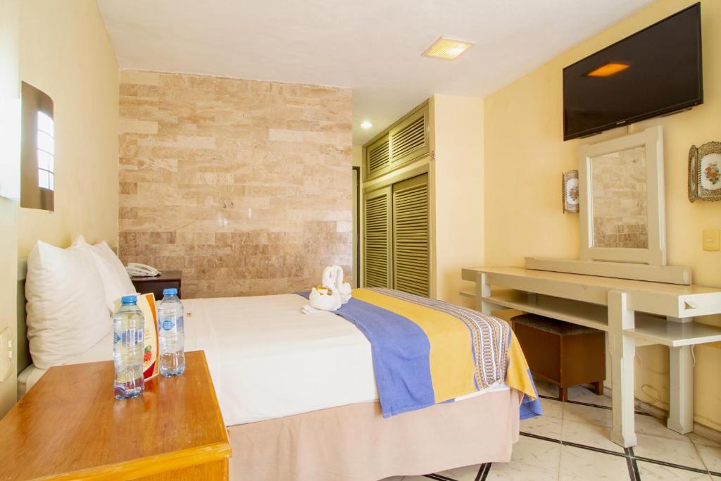 TV a/nebo společenská místnost v ubytování Hotel Ambassador Mérida