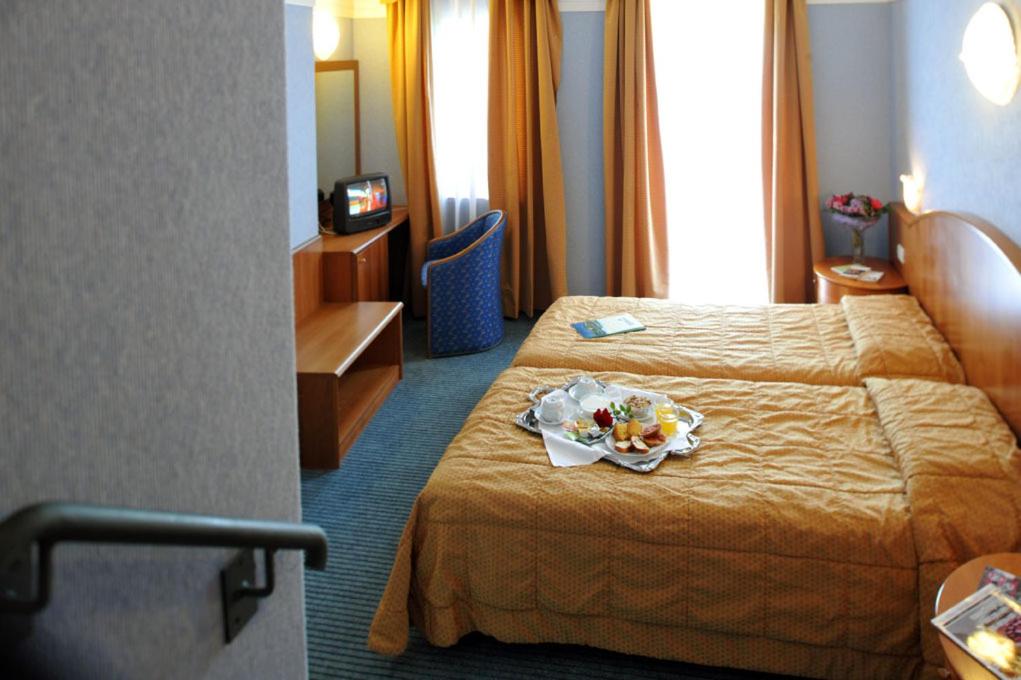 Postel nebo postele na pokoji v ubytování Park Hotel Jolanda