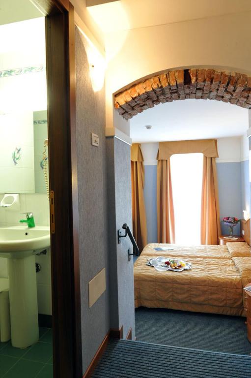 Postel nebo postele na pokoji v ubytování Park Hotel Jolanda
