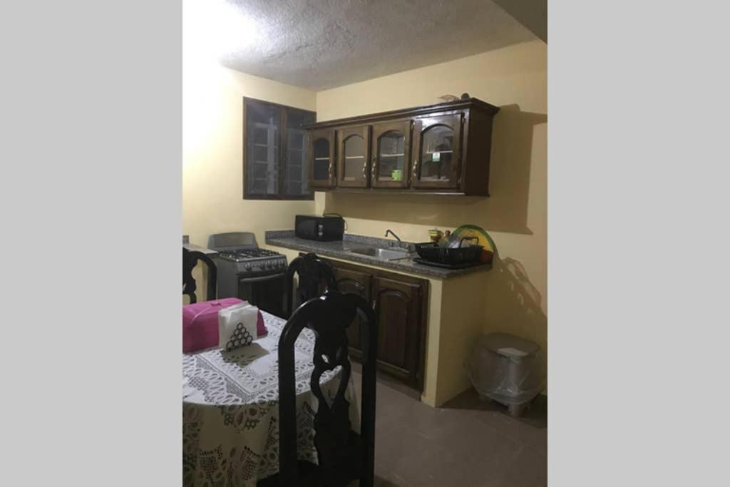 a kitchen with a sink and a counter top at Standard Private apartment in Tabarre