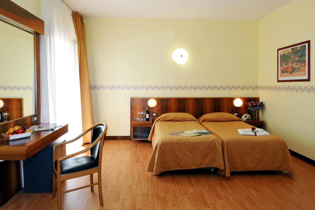 Postel nebo postele na pokoji v ubytování Park Hotel Jolanda