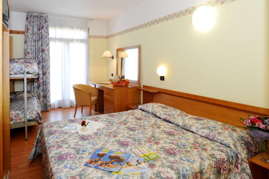 Postel nebo postele na pokoji v ubytování Park Hotel Jolanda