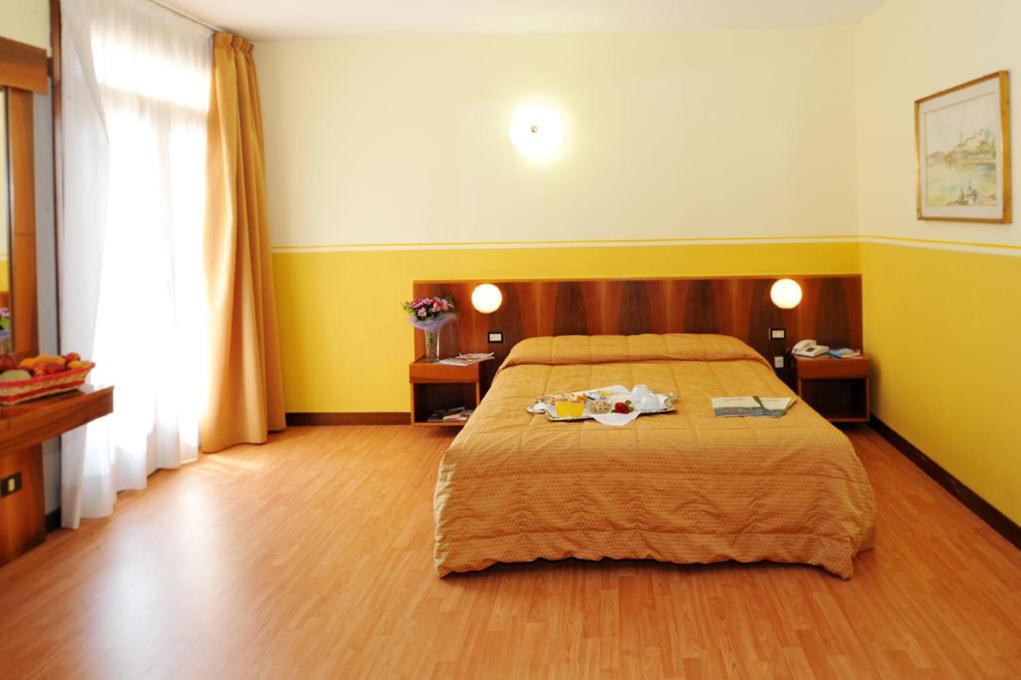 Postel nebo postele na pokoji v ubytování Park Hotel Jolanda