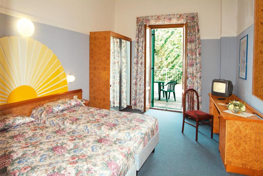 Postel nebo postele na pokoji v ubytování Park Hotel Jolanda