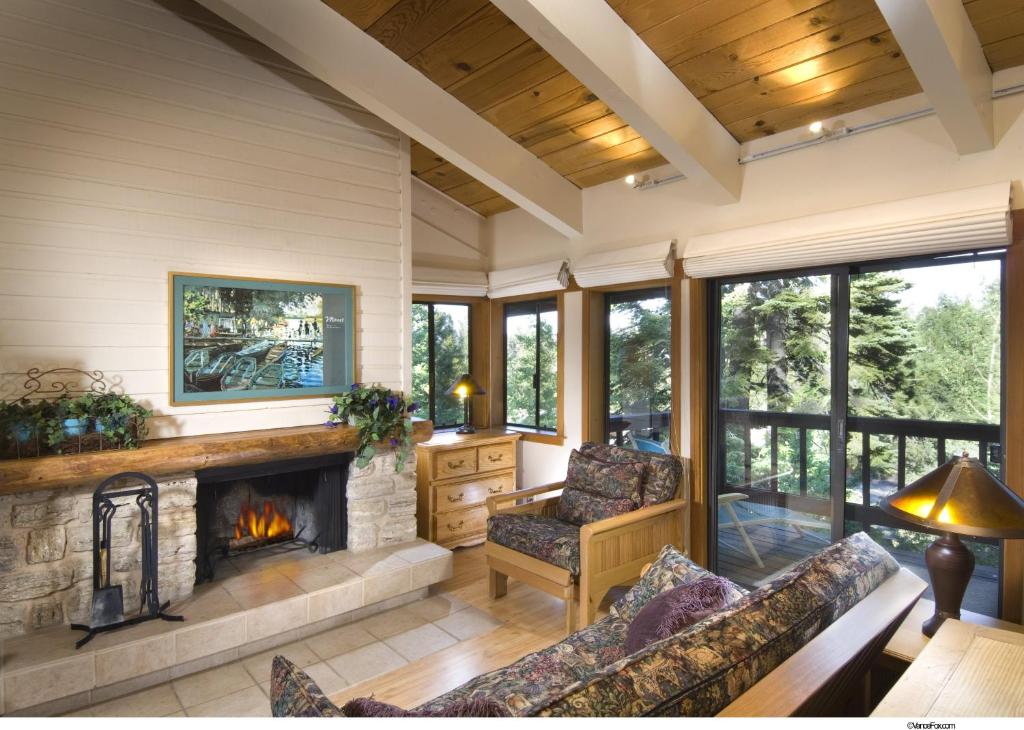 a living room with a fireplace in a house at Granlibakken Tahoe in Tahoe City