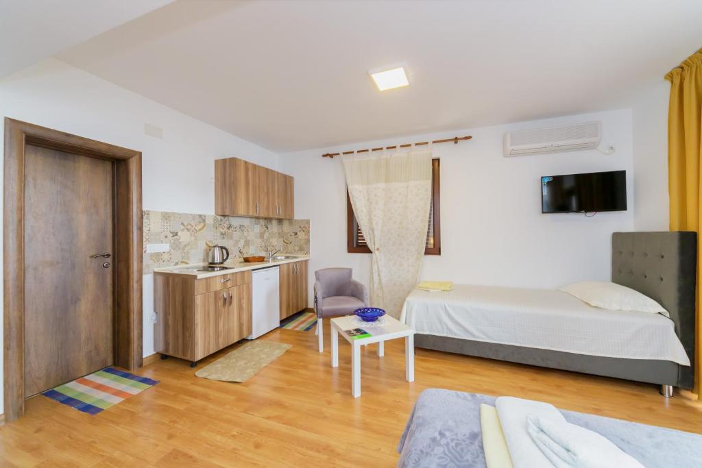Postel nebo postele na pokoji v ubytování Vila Fortuna