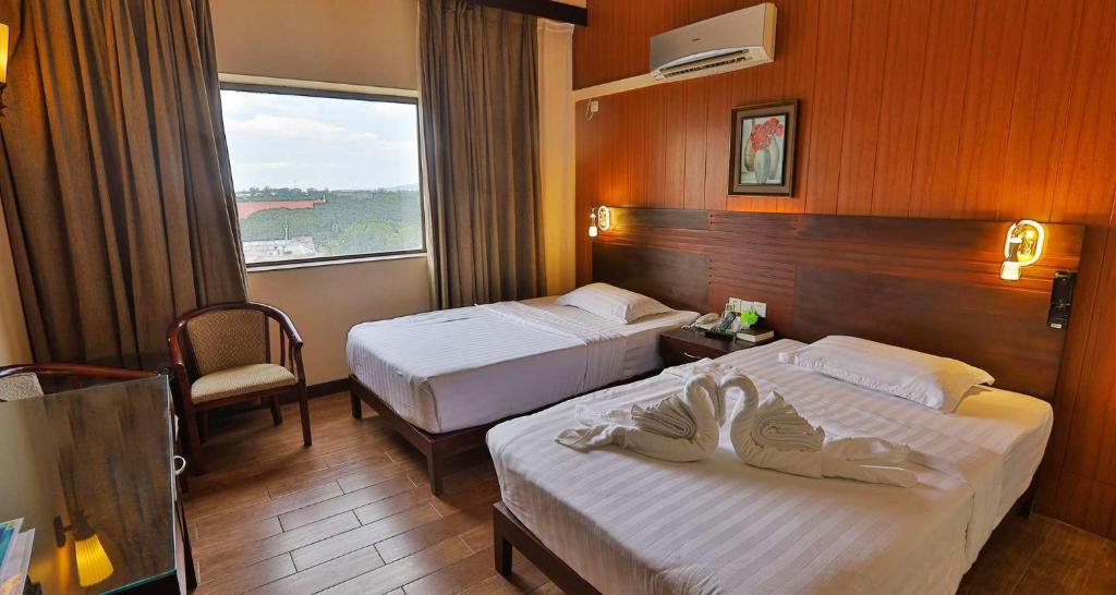Postel nebo postele na pokoji v ubytování Hotel Essencia