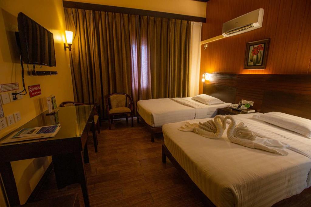 Postel nebo postele na pokoji v ubytování Hotel Essencia