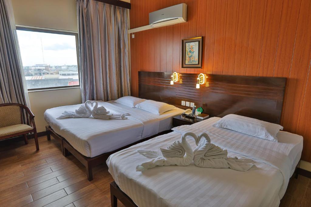 Postel nebo postele na pokoji v ubytování Hotel Essencia
