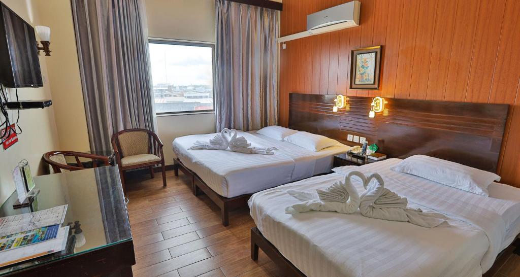 Postel nebo postele na pokoji v ubytování Hotel Essencia