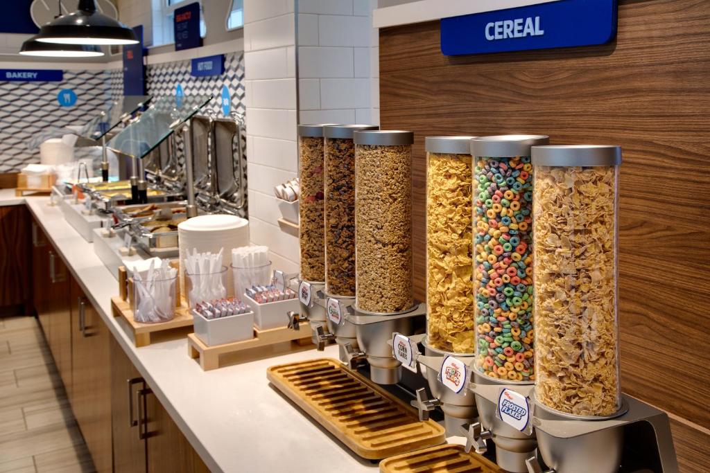 a row of cereal vending machines in a store at Holiday Inn Express & Suites S Lake Buena Vista by IHG in Kissimmee