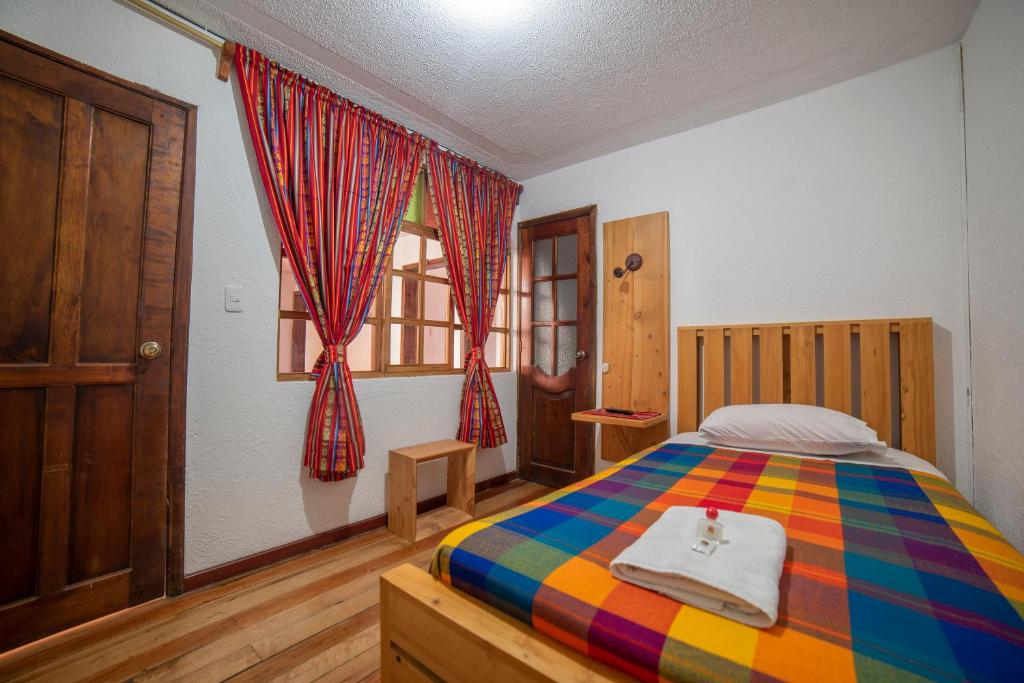 Postel nebo postele na pokoji v ubytování El Andariego