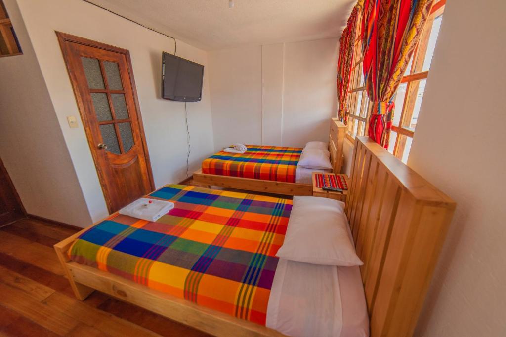 Postel nebo postele na pokoji v ubytování El Andariego