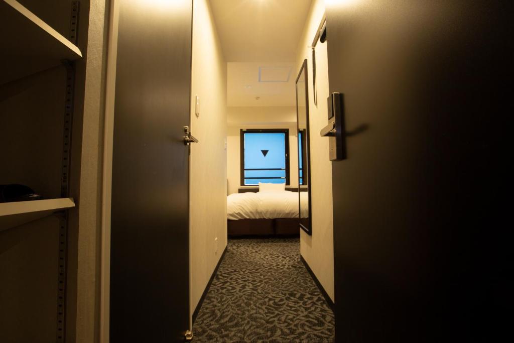 Postel nebo postele na pokoji v ubytování HOTEL PAR-MAN