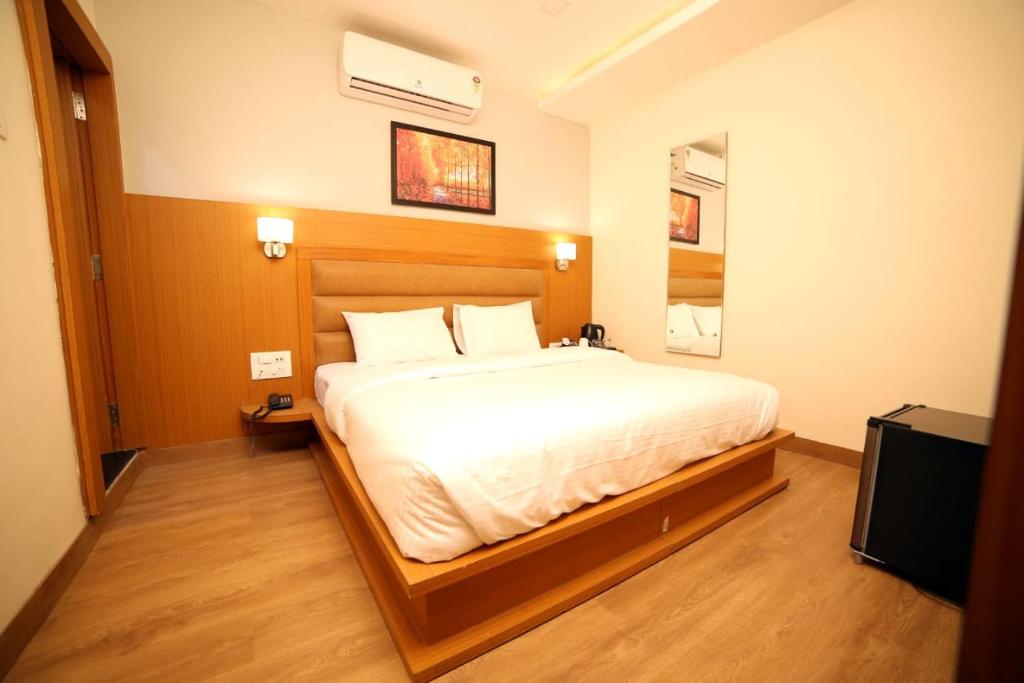 Postel nebo postele na pokoji v ubytování Banyan hotel&restro