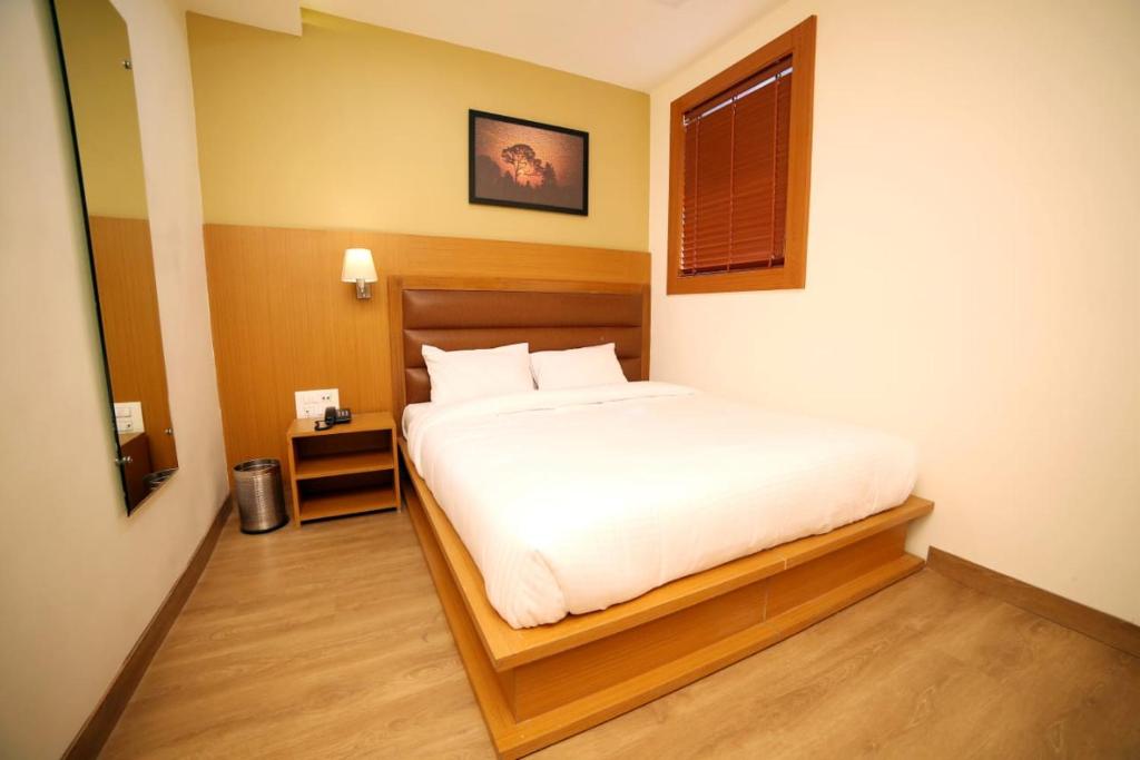 Postel nebo postele na pokoji v ubytování Banyan hotel&restro