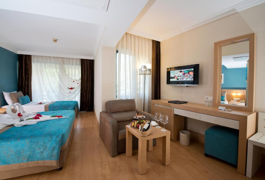 Postel nebo postele na pokoji v ubytování Limak Limra Hotel & Resort Kemer - Kids Concept