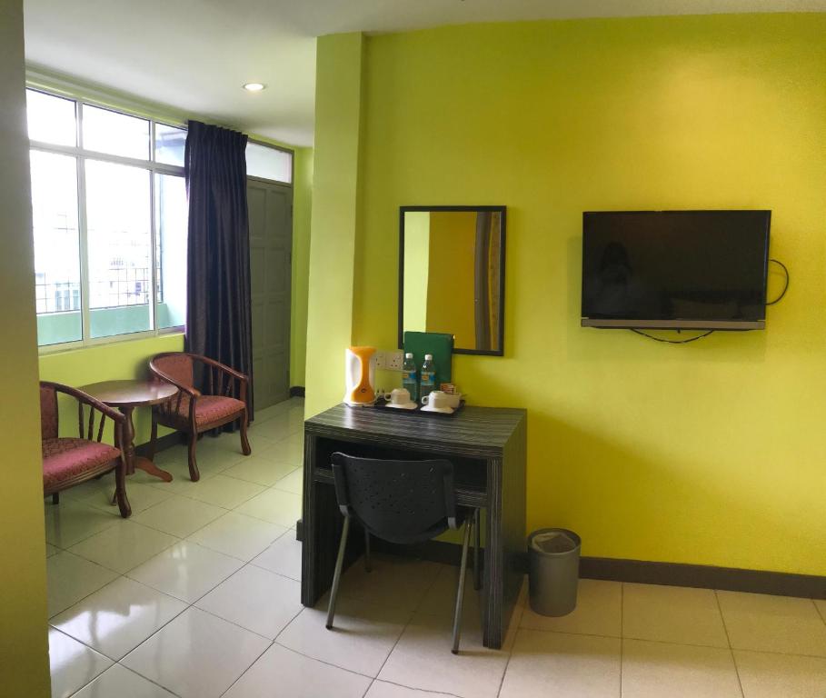 TV a/nebo společenská místnost v ubytování SARIKEI GARDEN HOTEL
