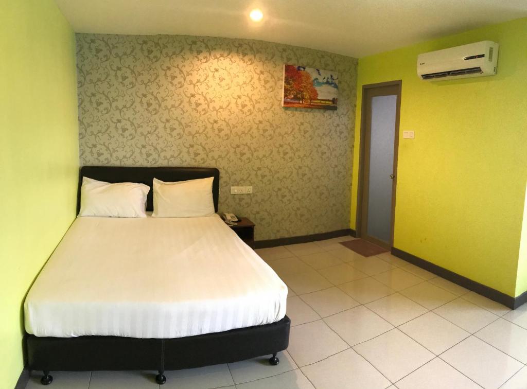 Postel nebo postele na pokoji v ubytování SARIKEI GARDEN HOTEL