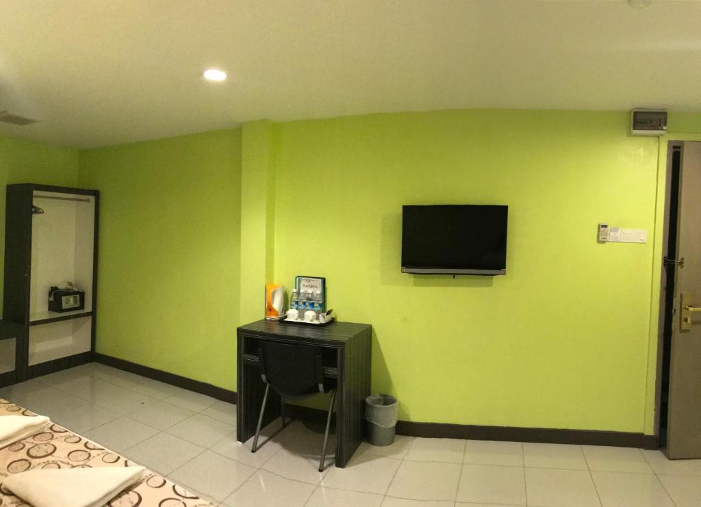 TV a/nebo společenská místnost v ubytování SARIKEI GARDEN HOTEL