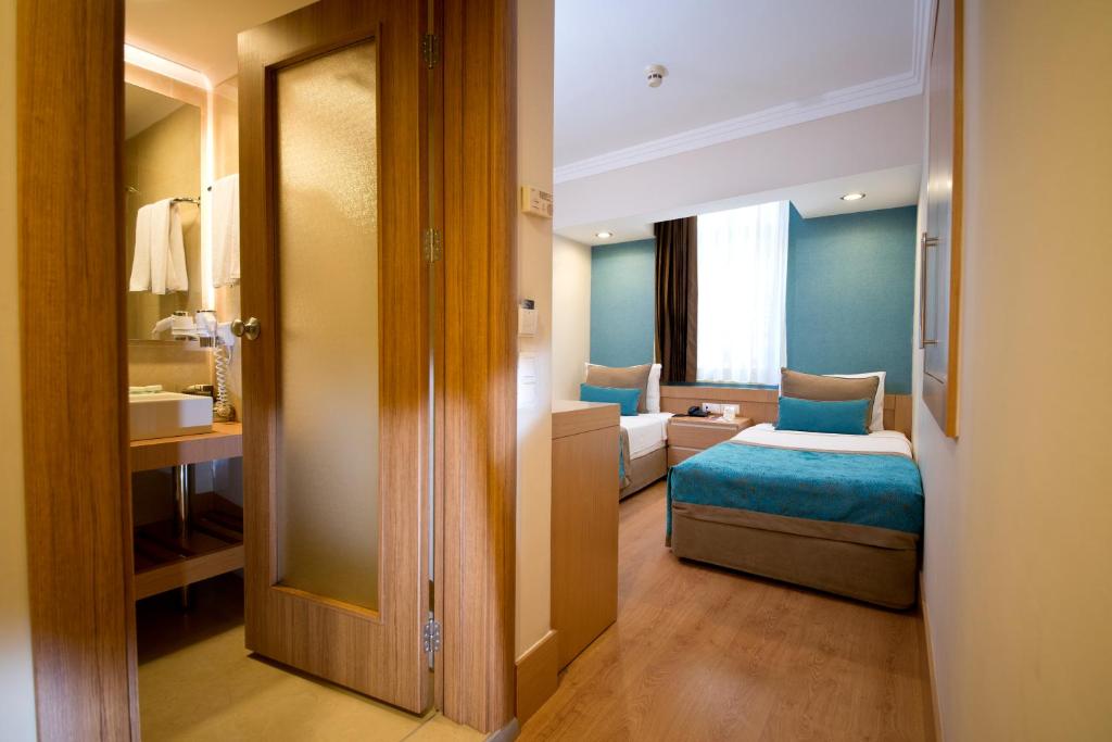 Postel nebo postele na pokoji v ubytování Limak Limra Hotel & Resort Kemer - Kids Concept