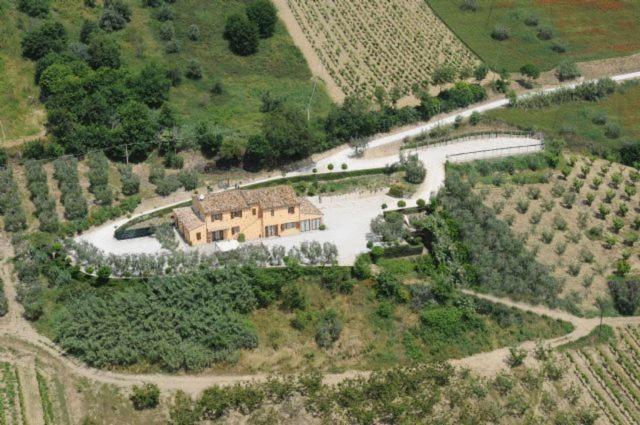 an aerial view of a house and a river at Acquarello in Lapedona
