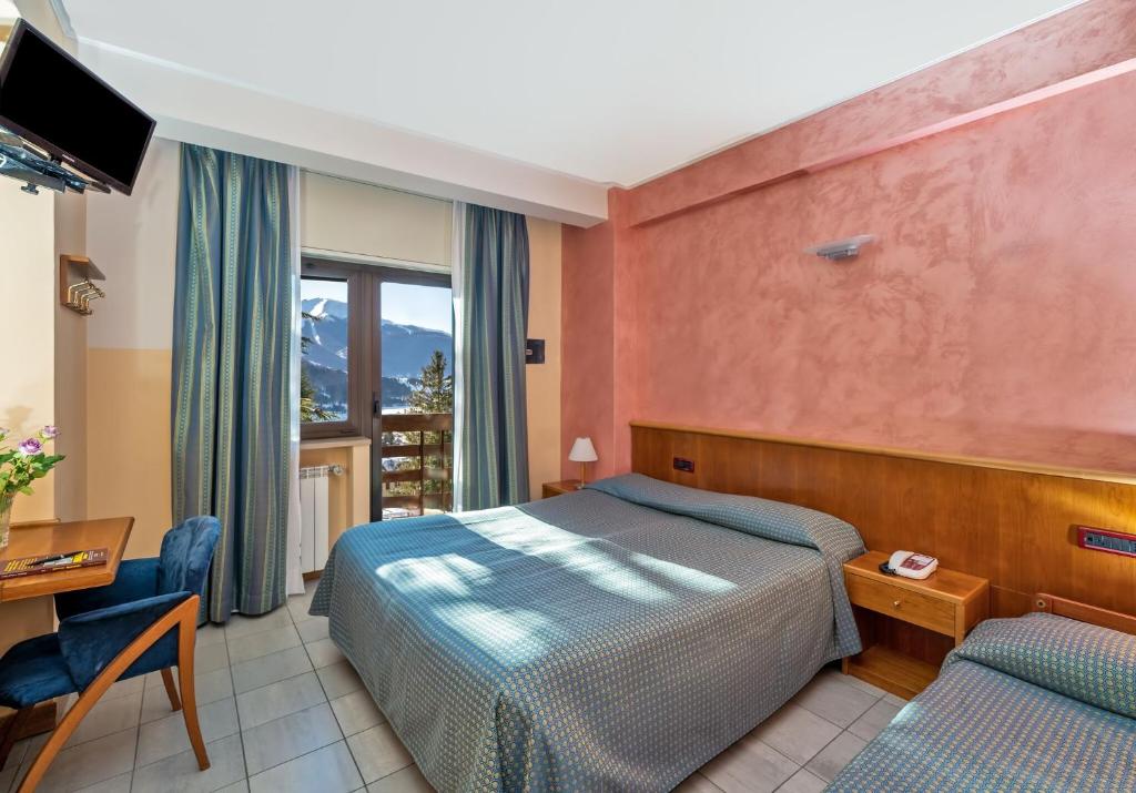 Postel nebo postele na pokoji v ubytování Cipriani Park Hotel