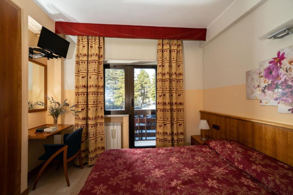 Postel nebo postele na pokoji v ubytování Cipriani Park Hotel