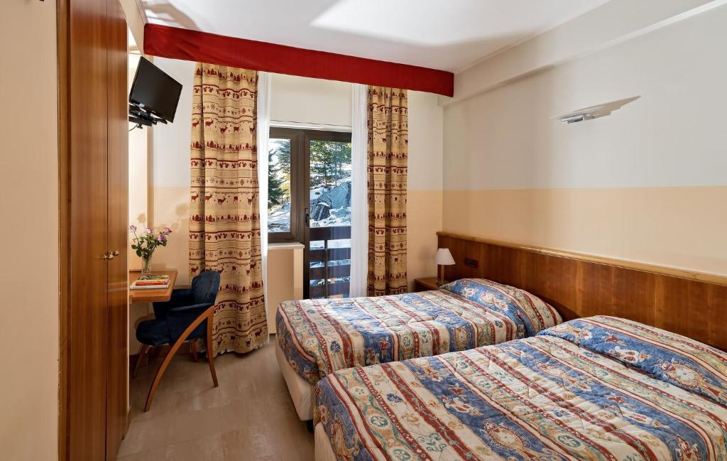 Postel nebo postele na pokoji v ubytování Cipriani Park Hotel